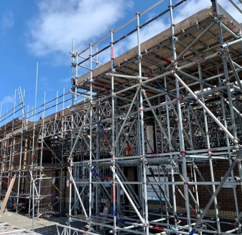 NYC commercial scaffolding setup with safety barriers on a Manhattan building.