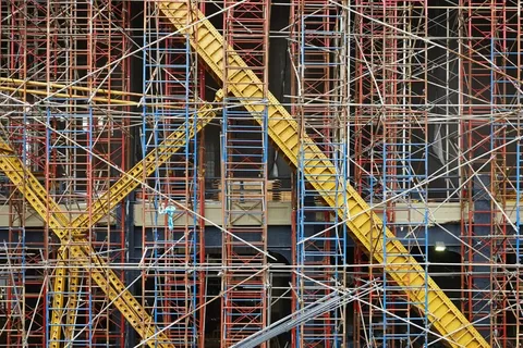 Dense network of scaffolding on a building facade.