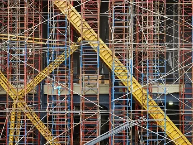 Dense network of scaffolding on a building facade.
